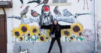 Street art murals on village house walls in Staro Zhelezare, the famous living gallery in Bulgaria.